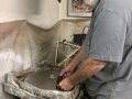 Grinding each half of the glass barrel to size on 60 grit diamond wheel with water as coolant